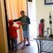 Cameron Awori, 5, and his brother Christian, 10, retrieve a frisbee from a hall closet as they go out to play in the courtyard. Melanie Maxwell | AnnArbor.com